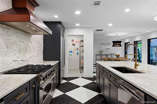 kitchen with black dishwasher, stainless steel range, island exhaust hood, hanging light fixtures, and a sink