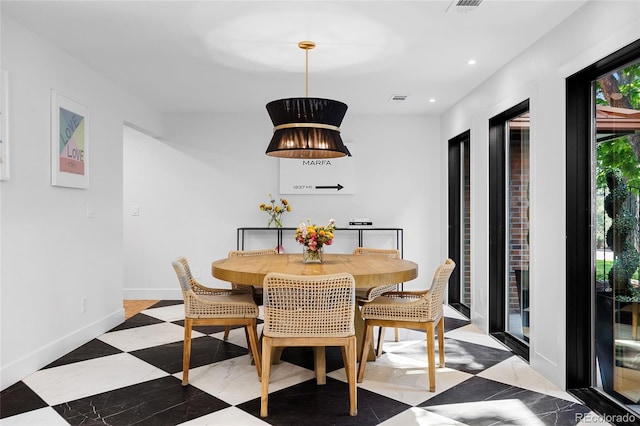 dining area featuring baseboards, visible vents, and recessed lighting