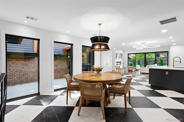 dining room with visible vents and recessed lighting