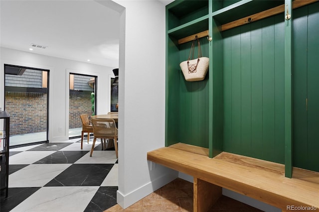 mudroom featuring recessed lighting, visible vents, and baseboards