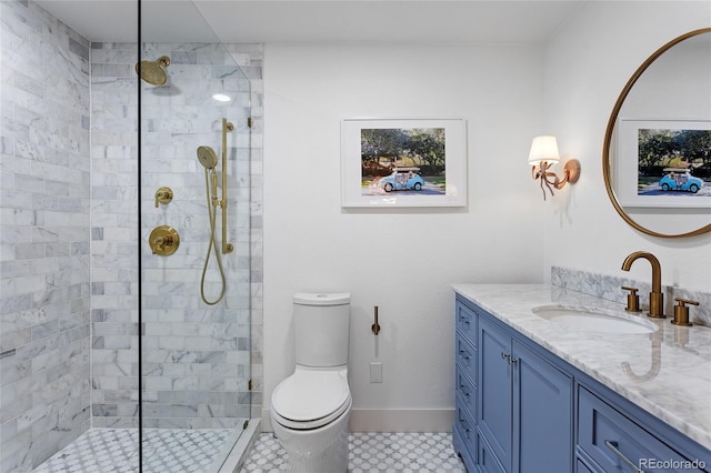 bathroom with baseboards, vanity, toilet, and walk in shower