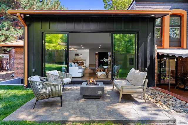 view of patio / terrace featuring an outdoor fire pit