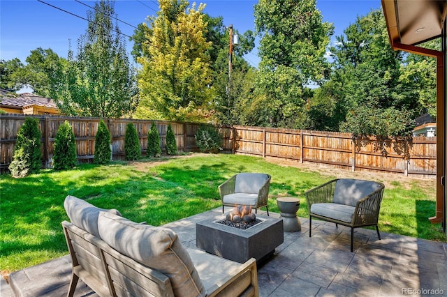 view of patio / terrace featuring a fire pit and a fenced backyard