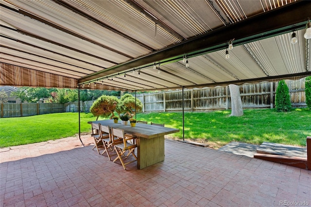 view of patio featuring a fenced backyard and outdoor dining space