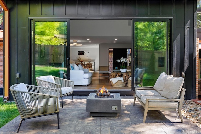 view of patio with an outdoor fire pit