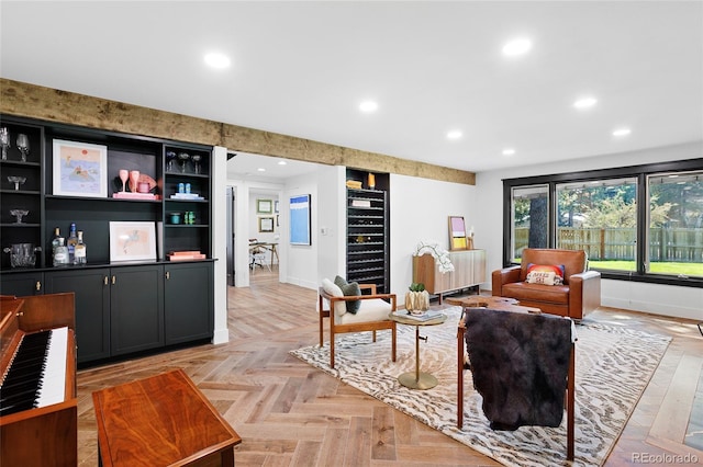 living area featuring wine cooler, radiator, baseboards, and recessed lighting