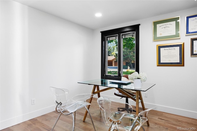 office space with recessed lighting, wood finished floors, and baseboards