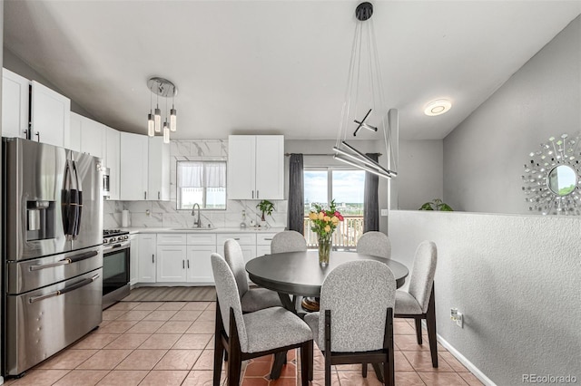 3296 S Bryant St, Englewood, CO 80110 - dining room with light tile patterned floors