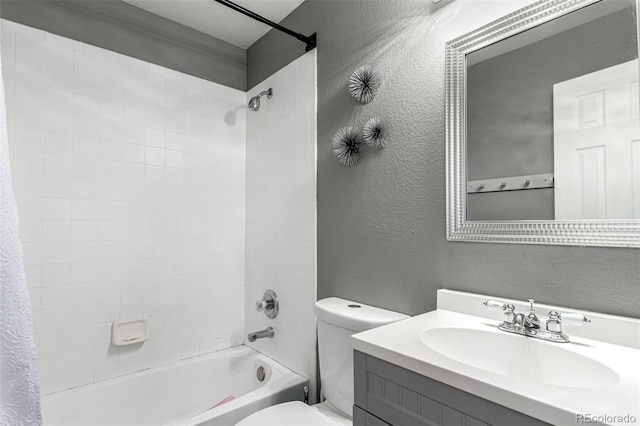 3296 S Bryant St, Englewood, CO 80110 - full bath with a textured wall, toilet, shower / bathtub combination with curtain, and vanity