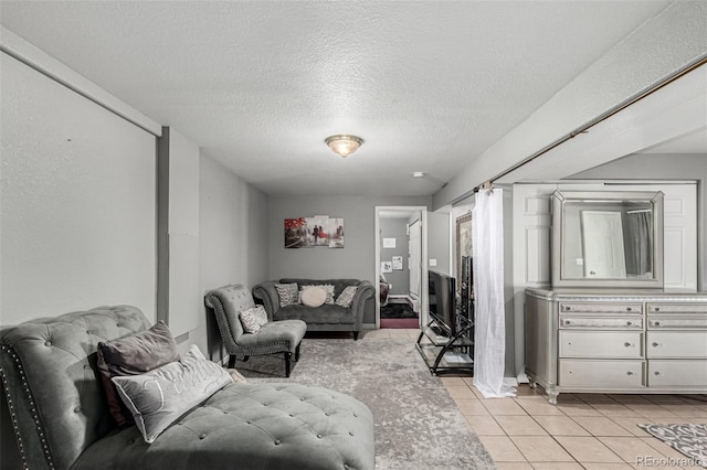 3296 S Bryant St, Englewood, CO 80110 - living room with light tile patterned flooring and a textured ceiling