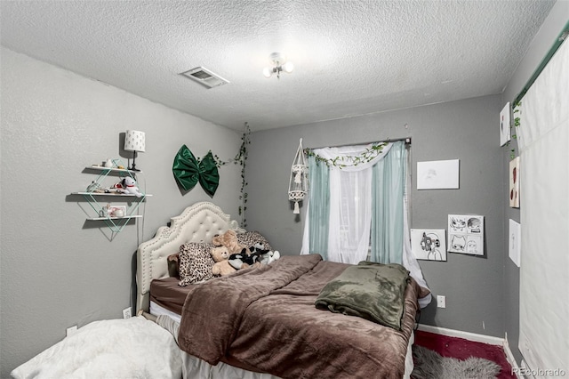 3296 S Bryant St, Englewood, CO 80110 - bedroom featuring a textured ceiling, carpet floors, and baseboards