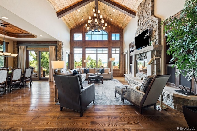 living room with dark wood-type flooring, high vaulted ceiling, beamed ceiling, a notable chandelier, and a fireplace