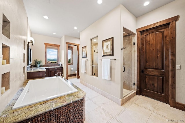 bathroom featuring tile patterned flooring, separate shower and tub, and toilet