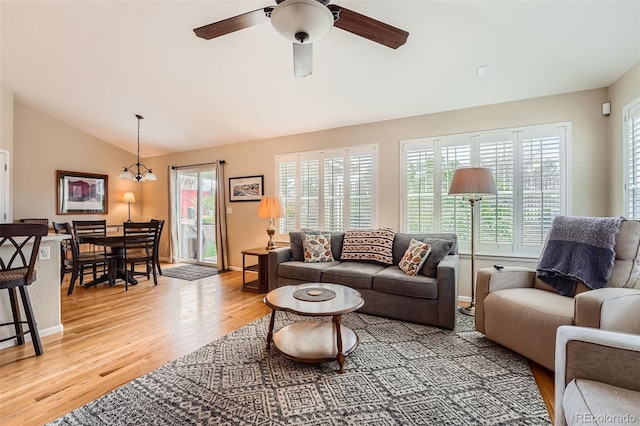 23808 E Bellewood Dr, Aurora, CO 80016 - living room featuring vaulted ceiling, light wood finished floors, and ceiling fan