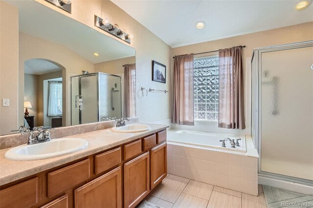 23808 E Bellewood Dr, Aurora, CO 80016 - bathroom with a shower stall, a bath, double vanity, and tile patterned flooring