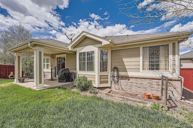 23808 E Bellewood Dr, Aurora, CO 80016 - view of front of house featuring a patio and a shingled roof