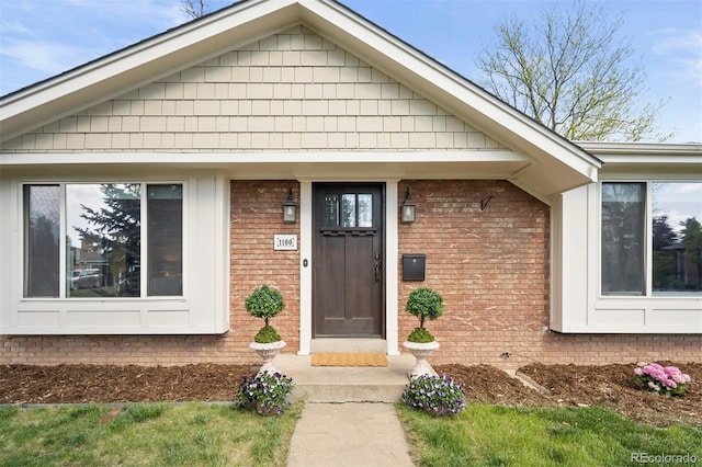 1100 Pontiac St, Denver, CO 80220 - view of exterior entry featuring brick siding