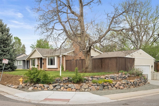 1100 Pontiac St, Denver, CO 80220 - single story home featuring an attached garage and brick siding