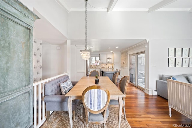 1100 Pontiac St, Denver, CO 80220 - dining area featuring wood finished floors, ornamental molding, and a baseboard heating unit