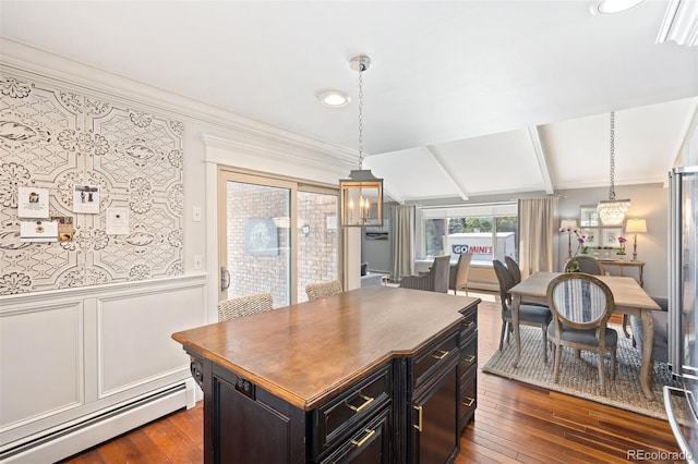 1100 Pontiac St, Denver, CO 80220 - kitchen with a baseboard radiator, dark wood finished floors, crown molding, decorative light fixtures, and a center island