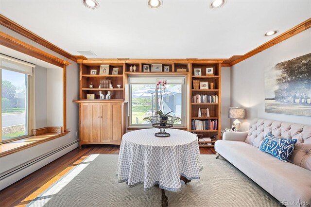 1100 Pontiac St, Denver, CO 80220 - living area with baseboard heating, ornamental molding, plenty of natural light, wood finished floors, and recessed lighting