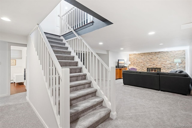 1100 Pontiac St, Denver, CO 80220 - stairway featuring carpet, recessed lighting, a fireplace, and baseboards