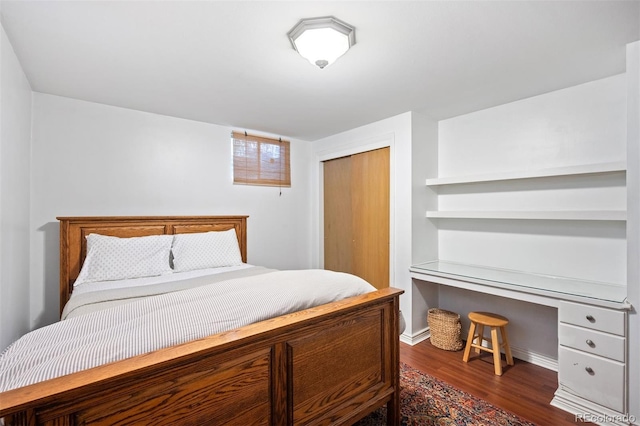 1100 Pontiac St, Denver, CO 80220 - bedroom with wood finished floors, a closet, baseboards, and a desk