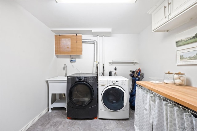 1100 Pontiac St, Denver, CO 80220 - laundry room featuring cabinet space, washing machine and dryer, and baseboards