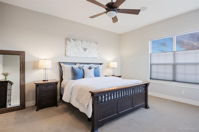 bedroom featuring carpet flooring, a ceiling fan, and baseboards