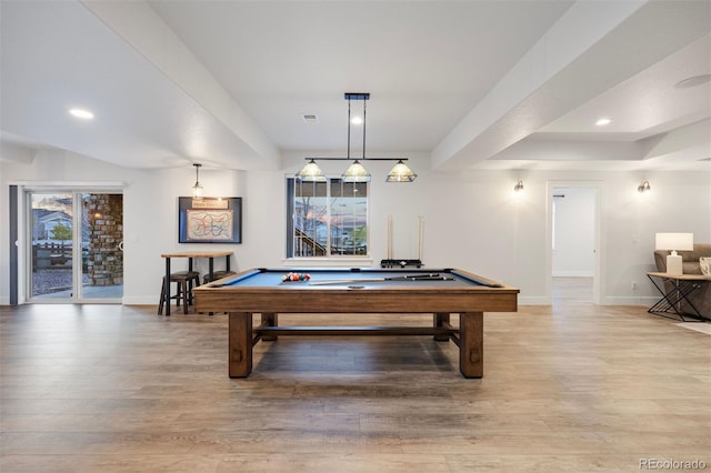 recreation room with baseboards, a wealth of natural light, and light wood-type flooring