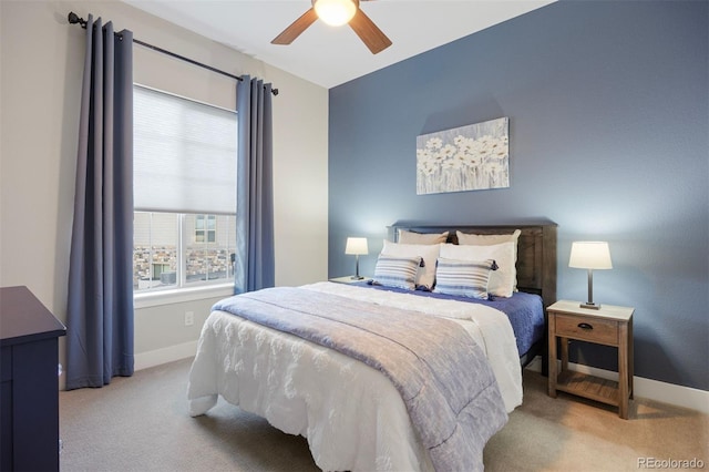 bedroom featuring a ceiling fan, baseboards, and carpet
