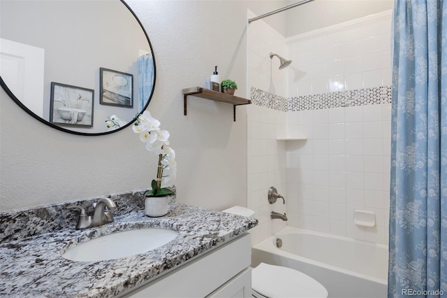 bathroom featuring vanity, toilet, and shower / tub combo