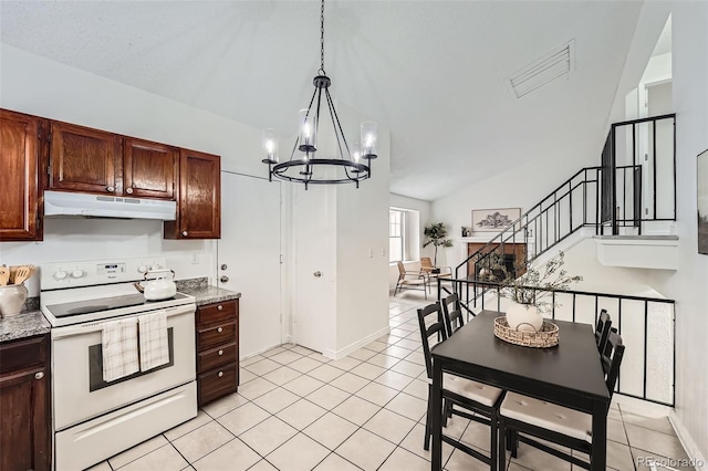 kitchen with lofted ceiling, light countertops, under cabinet range hood, white range with electric cooktop, and light tile patterned flooring