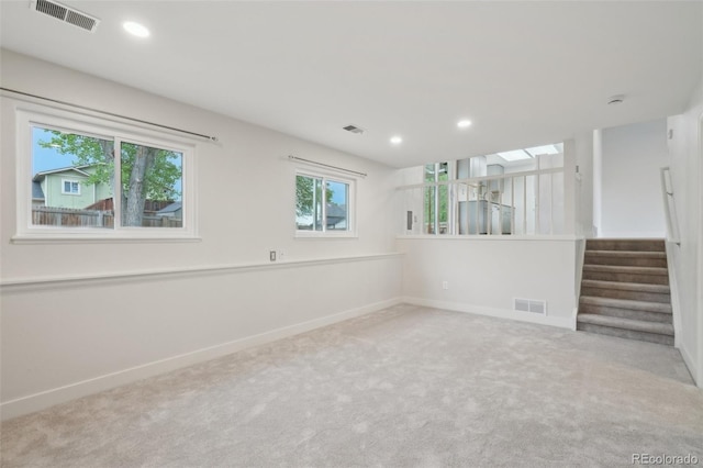 6337 W 68th Pl, Arvada, CO 80003 - spare room featuring carpet floors, stairway, baseboards, and recessed lighting