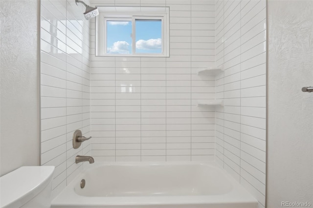 6337 W 68th Pl, Arvada, CO 80003 - full bath with toilet, a textured wall, and washtub / shower combination