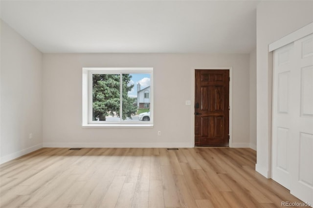 6337 W 68th Pl, Arvada, CO 80003 - foyer with light wood finished floors and baseboards