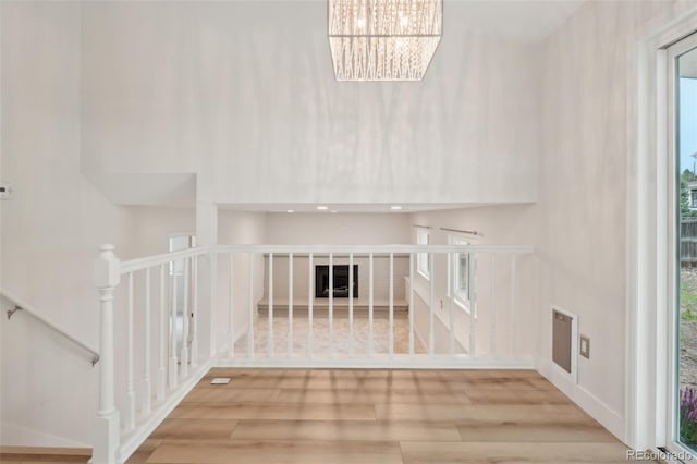 6337 W 68th Pl, Arvada, CO 80003 - interior space featuring wood finished floors and a chandelier