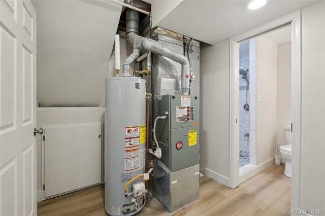 6337 W 68th Pl, Arvada, CO 80003 - utility room with water heater and heating unit