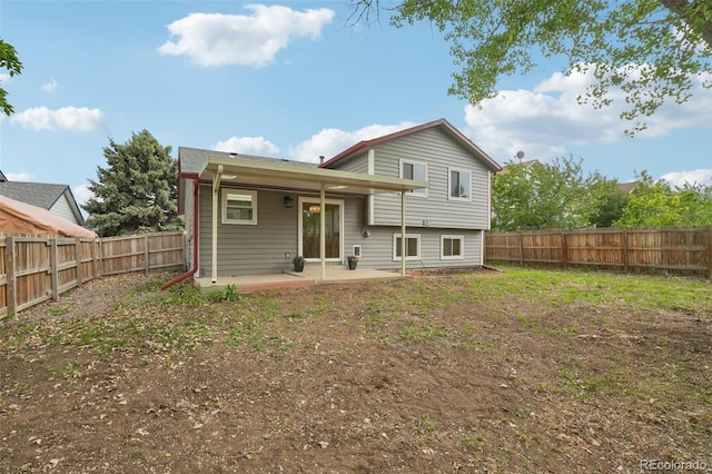 6337 W 68th Pl, Arvada, CO 80003 - back of property featuring a patio area and a fenced backyard
