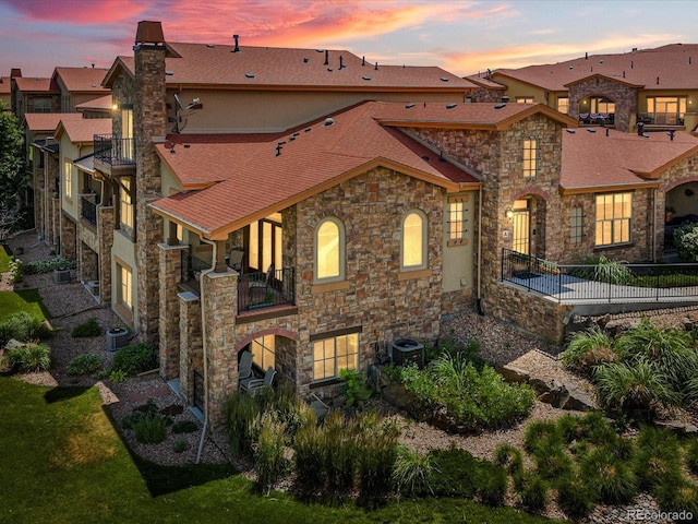 2363 Primo Rd Unit A, Highlands Ranch, CO 80129 - mediterranean / spanish-style house with stone siding and a balcony