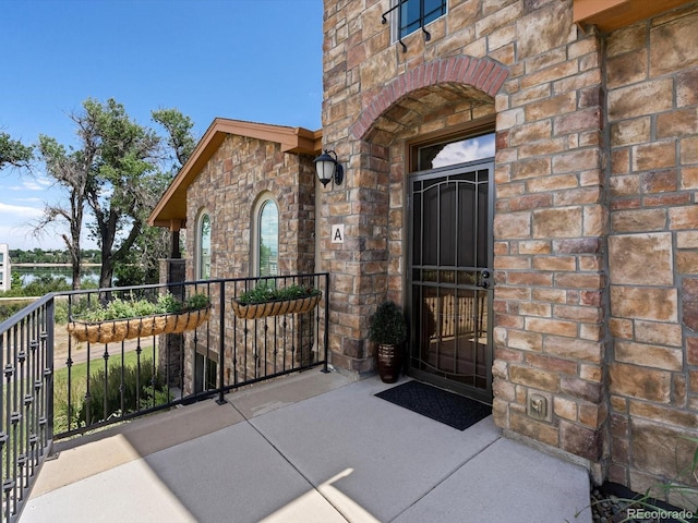 2363 Primo Rd Unit A, Highlands Ranch, CO 80129 - property entrance featuring stone siding and brick siding