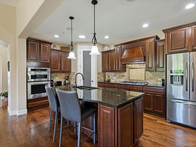 2363 Primo Rd Unit A, Highlands Ranch, CO 80129 - kitchen featuring stainless steel appliances, custom range hood, dark wood-style flooring, a kitchen bar, and backsplash