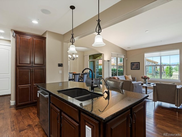 2363 Primo Rd Unit A, Highlands Ranch, CO 80129 - kitchen with a chandelier, dark wood finished floors, dark stone counters, vaulted ceiling, and open floor plan