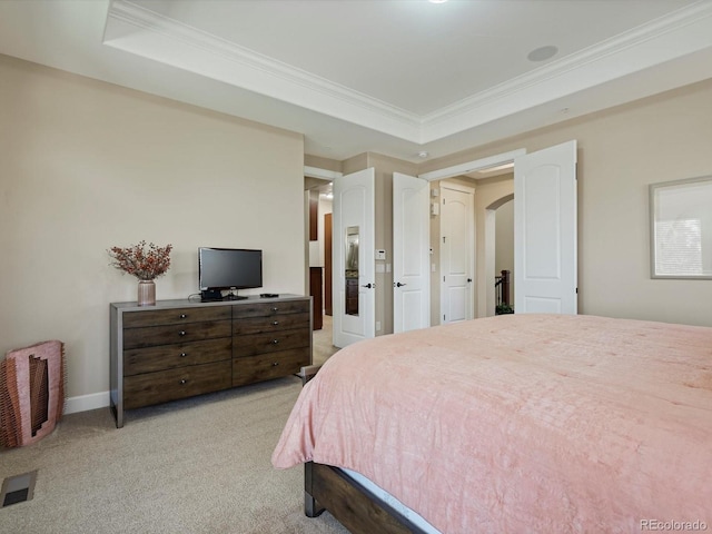 2363 Primo Rd Unit A, Highlands Ranch, CO 80129 - bedroom featuring light colored carpet, crown molding, arched walkways, and a tray ceiling