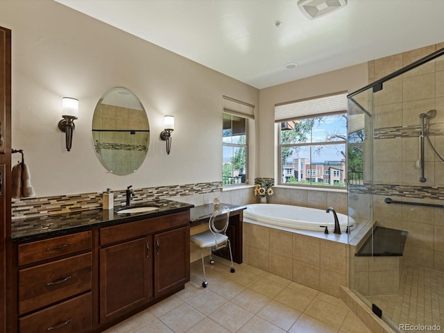2363 Primo Rd Unit A, Highlands Ranch, CO 80129 - bathroom with a shower stall, tile patterned floors, a garden tub, vanity, and tasteful backsplash