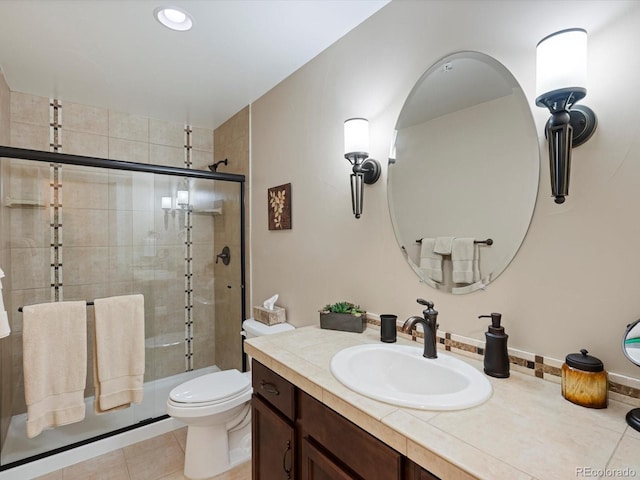 2363 Primo Rd Unit A, Highlands Ranch, CO 80129 - bathroom with vanity, tiled shower, and tile patterned flooring