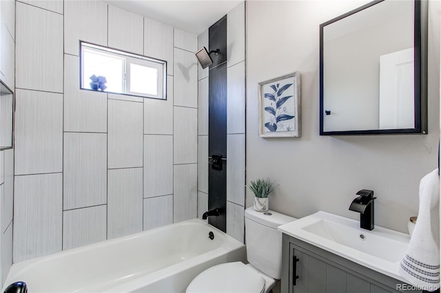 full bathroom featuring vanity, toilet, and tiled shower / bath combo