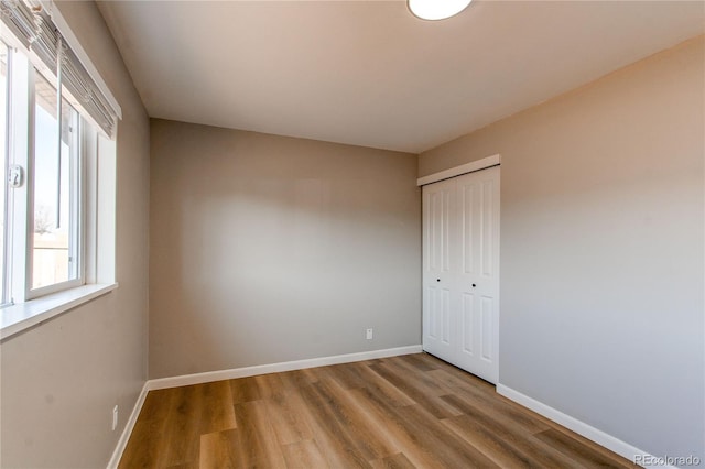 unfurnished room featuring hardwood / wood-style flooring