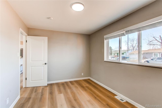 empty room featuring light hardwood / wood-style floors