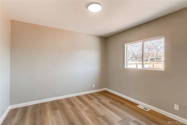 unfurnished room featuring light hardwood / wood-style floors